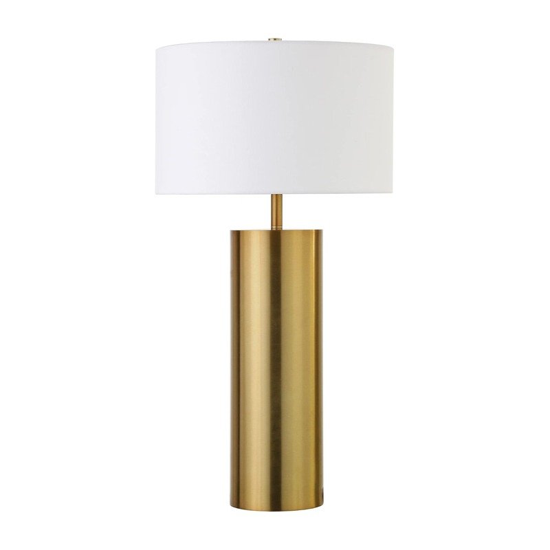 Modern brass table lamp with a cream fabric drum shade