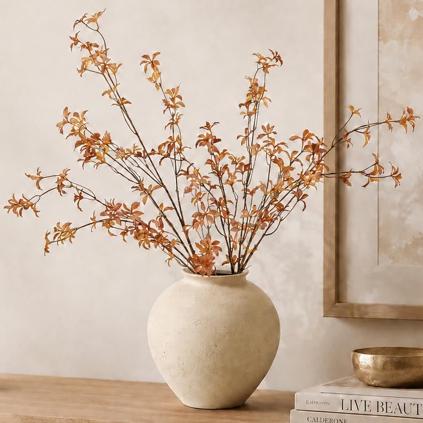 Rust-colored fall branches with warm brown and muted orange leaves