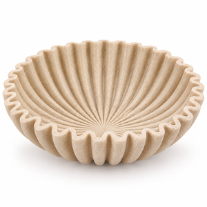 Sculptural scalloped decorative bowl in a warm beige stone-look finish.