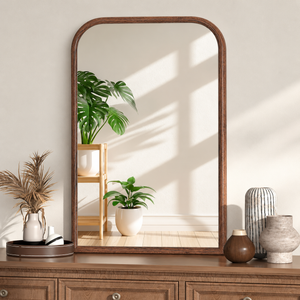 Walnut framed wall mirror for a warm neutral entryway console table